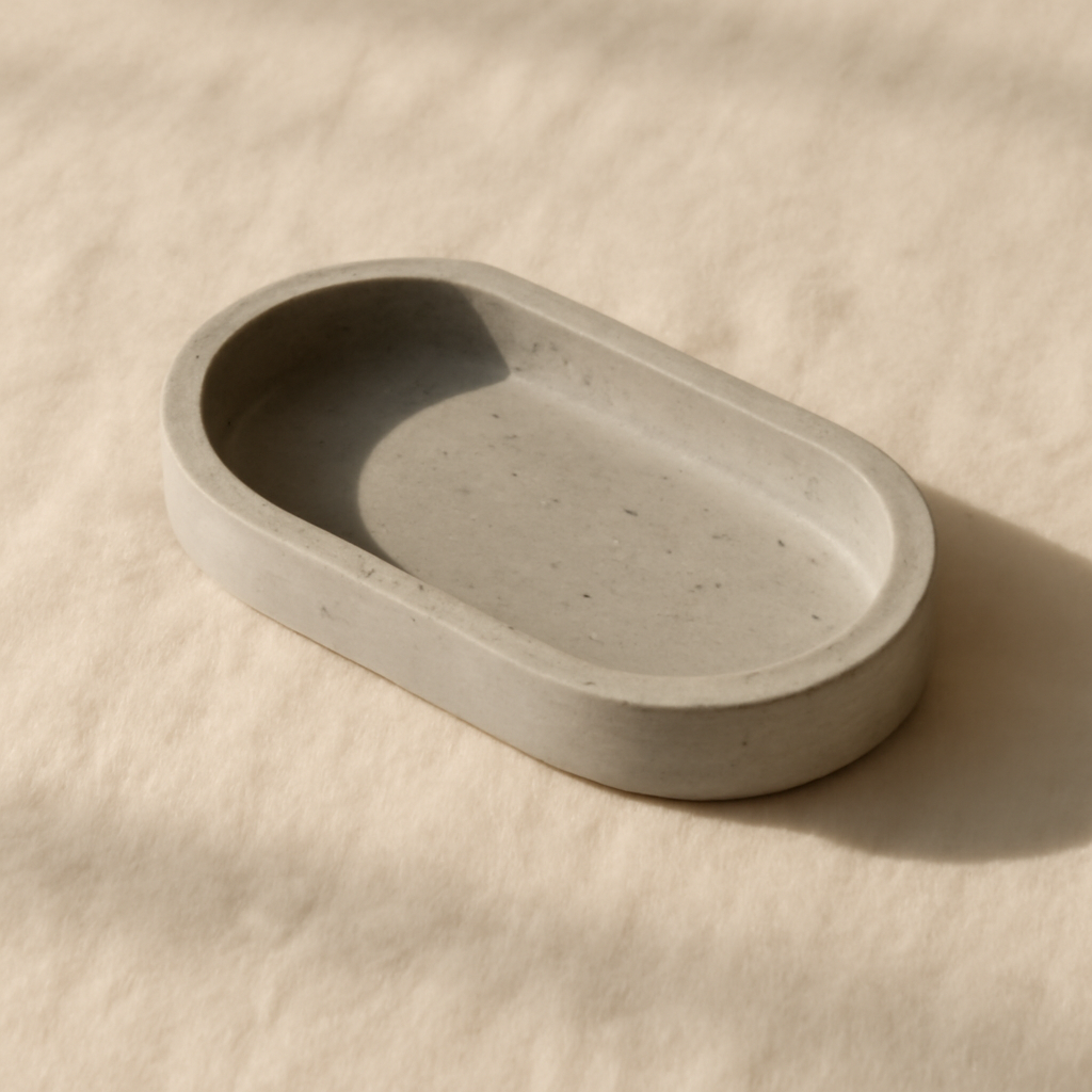 Oval concrete catchall in a simple, hand-finished form